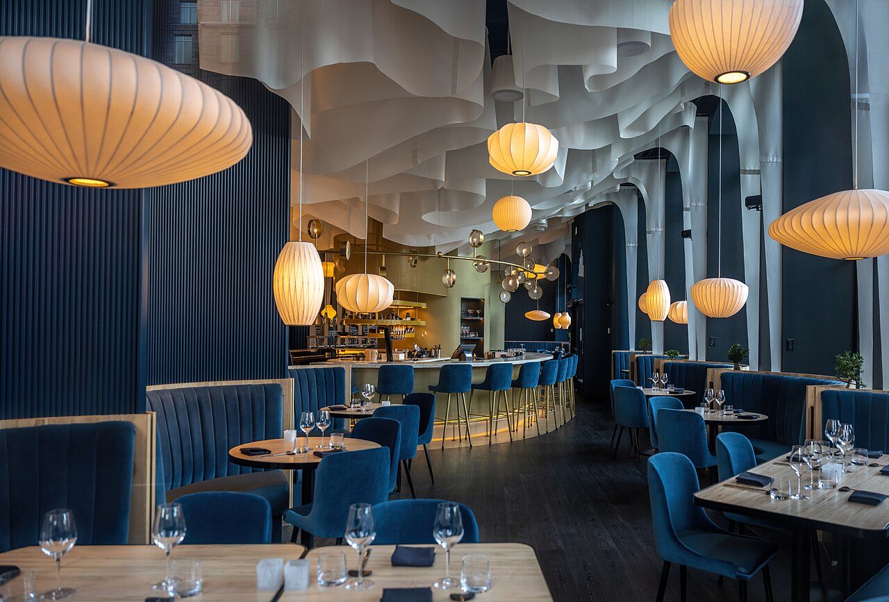 The dining room at Verde Table, glowing with paper lanterns